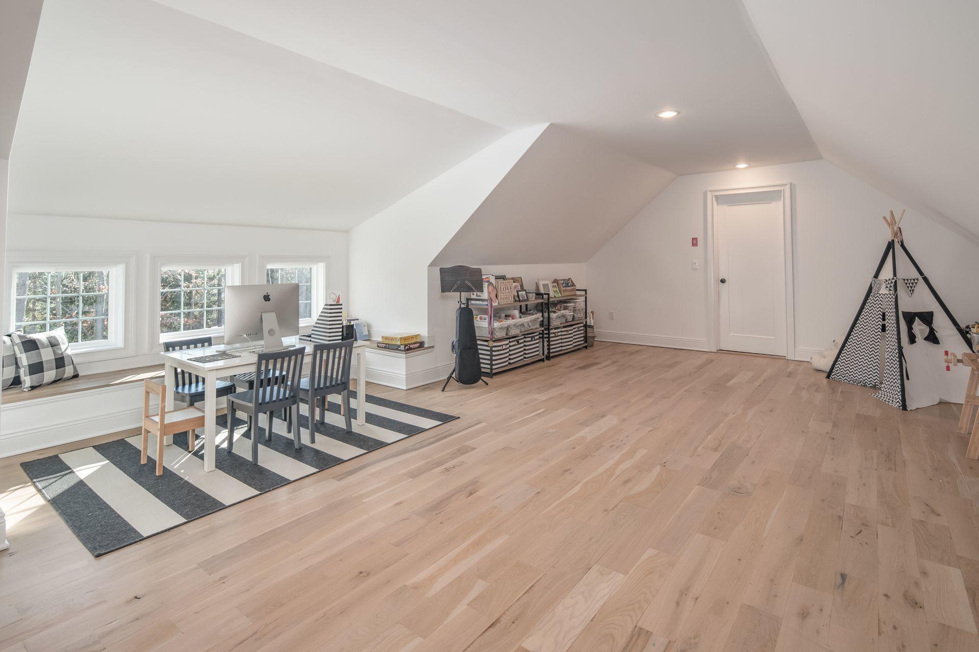 716 Cheese Spring Road New Canaan, CT 06840 - Photo 31 of 56 a view of a room with furniture and wooden floor