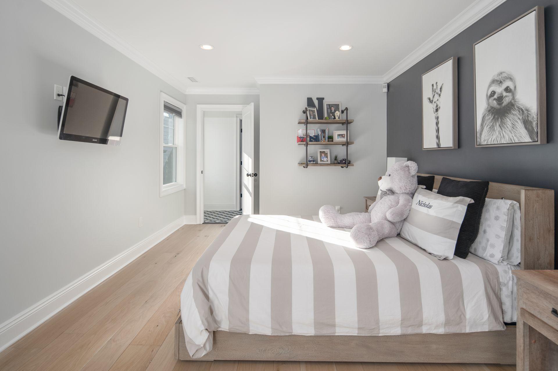 716 Cheese Spring Road New Canaan, CT 06840 - Photo 35 of 56 a bedroom with a bed and a flat screen tv