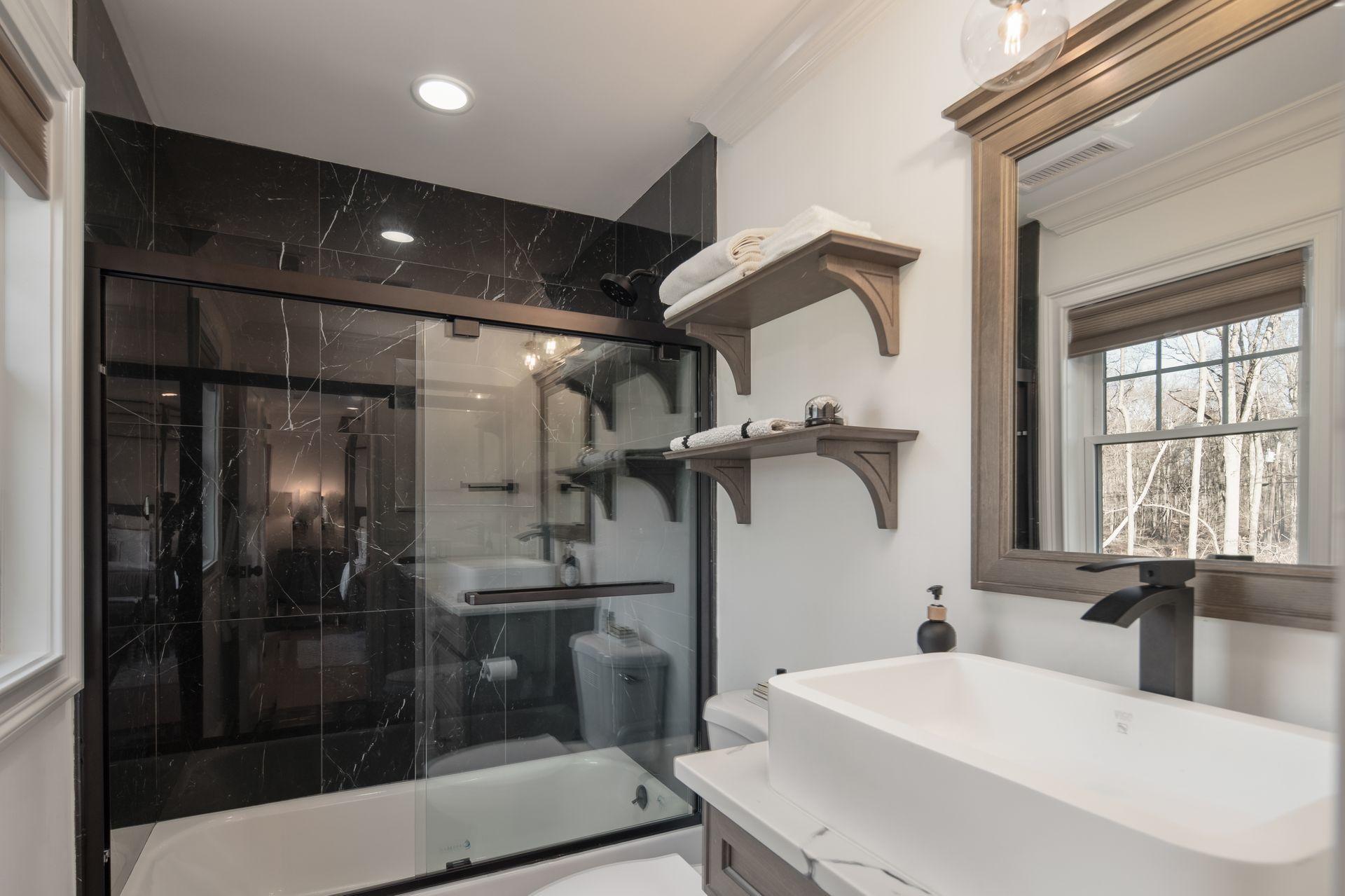 716 Cheese Spring Road New Canaan, CT 06840 - Photo 37 of 56 a bathroom with a sink and mirror