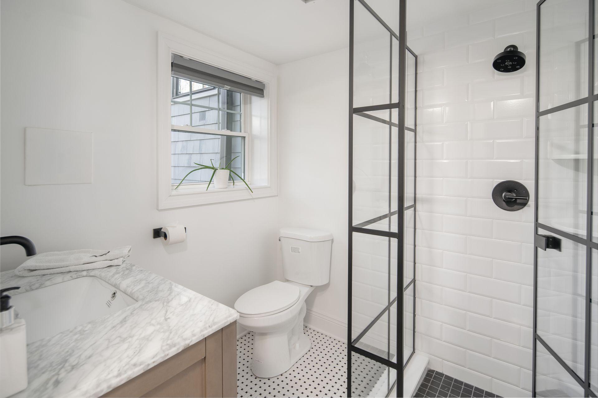716 Cheese Spring Road New Canaan, CT 06840 - Photo 40 of 56 a bathroom with a granite countertop sink toilet and shower