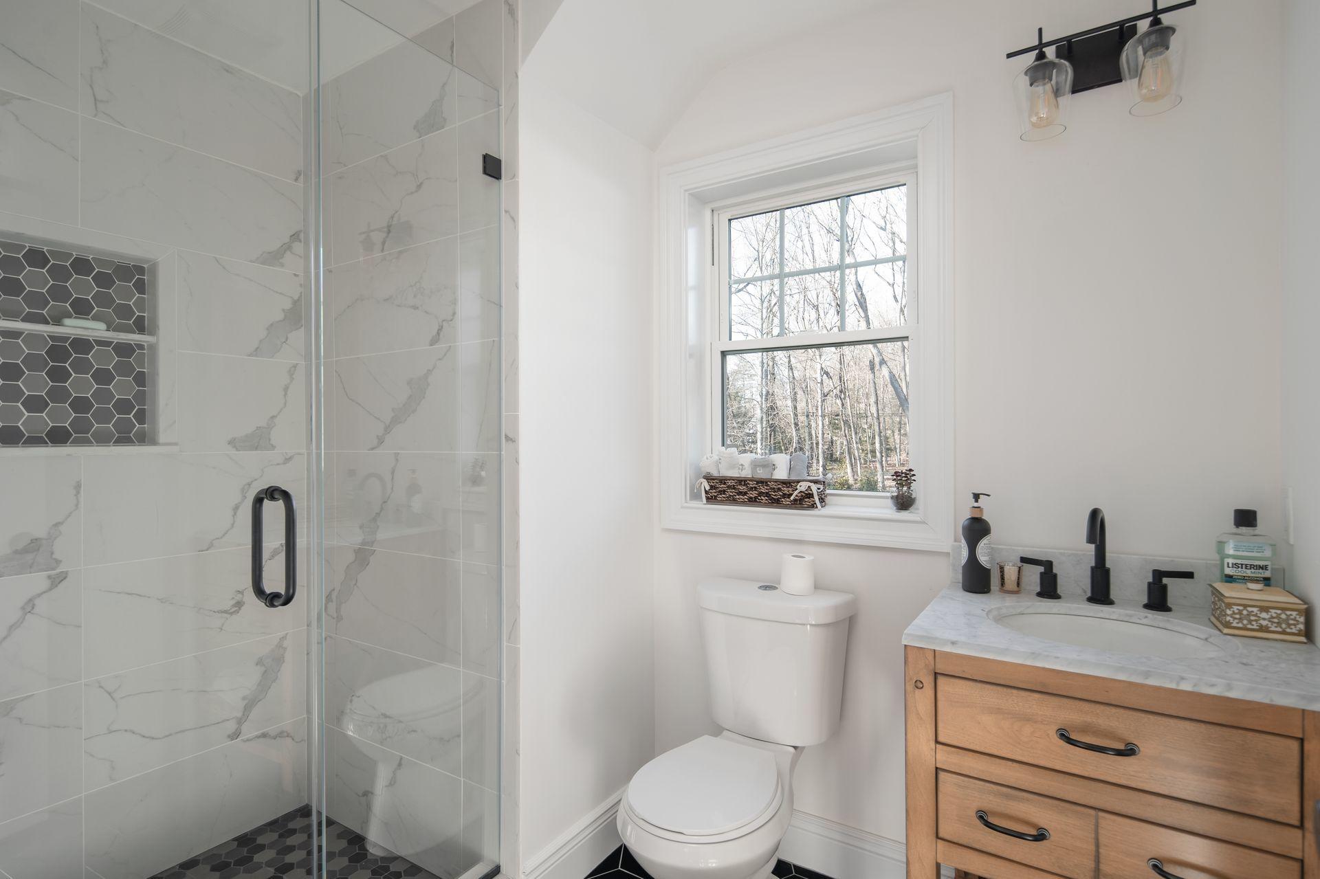 716 Cheese Spring Road New Canaan, CT 06840 - Photo 45 of 56 a bathroom with a granite countertop toilet sink and mirror