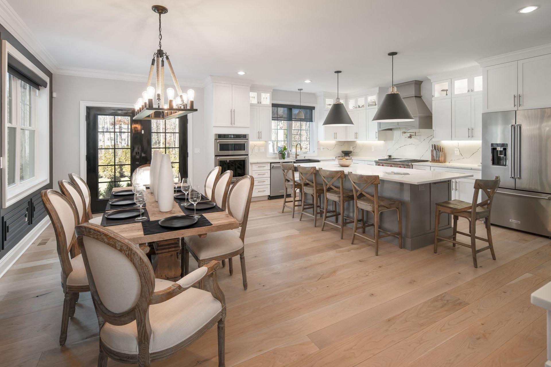 716 Cheese Spring Road New Canaan, CT 06840 - Photo 6 of 56 a dining room with stainless steel appliances kitchen island granite countertop a dining table chairs and a refrigerator