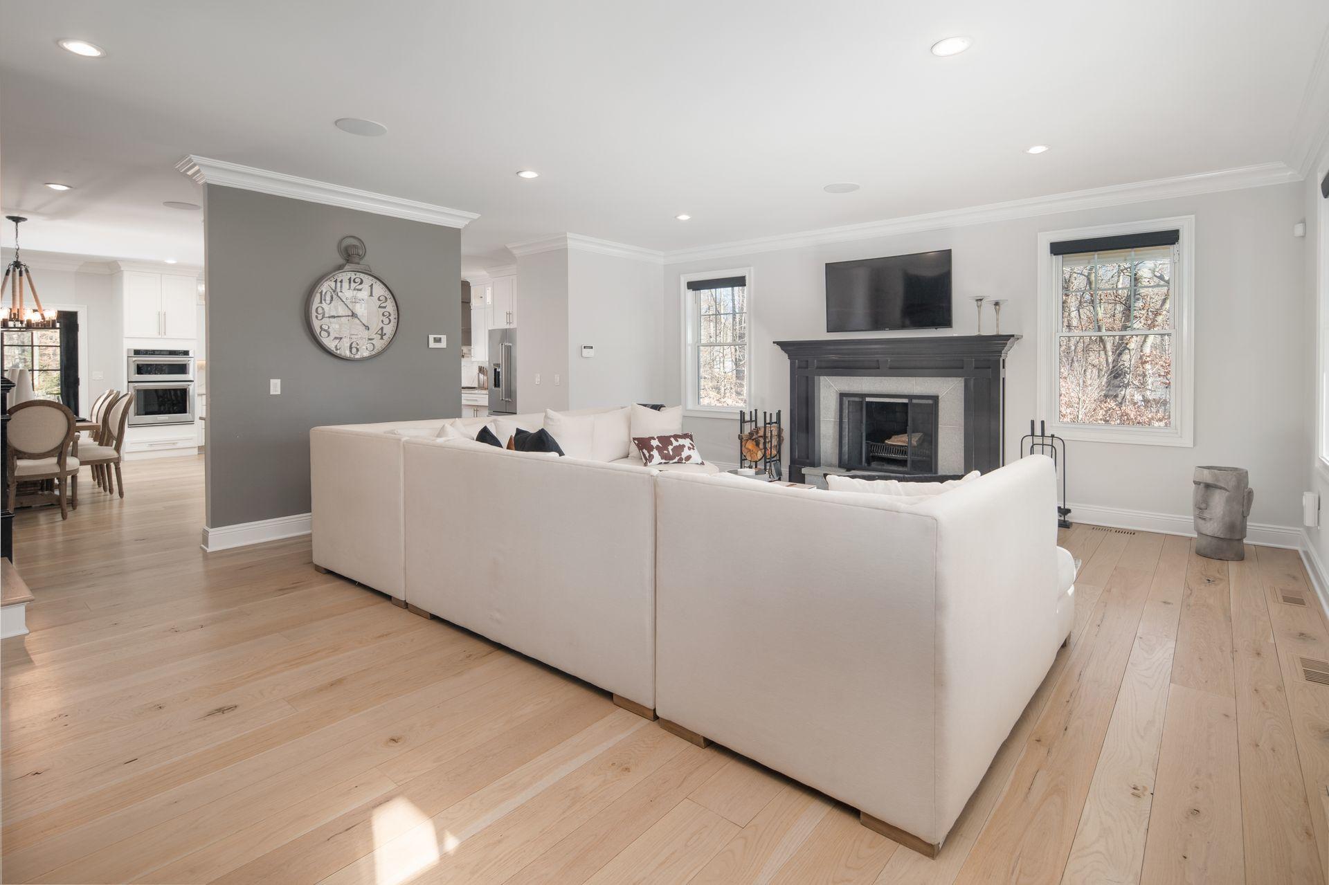 716 Cheese Spring Road New Canaan, CT 06840 - Photo 8 of 56 a living room with furniture a fireplace and a table