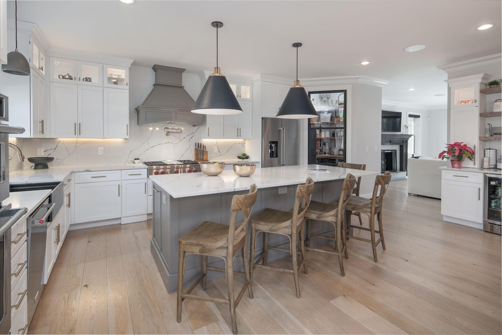 716 Cheese Spring Road New Canaan, CT 06840 - Photo 9 of 56 a kitchen with a dining table chairs sink and cabinets