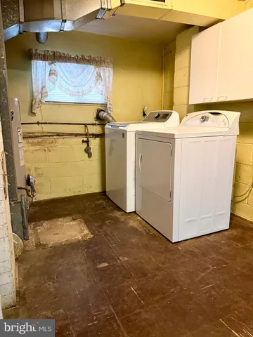a view of storage and utility room with washer and dryer