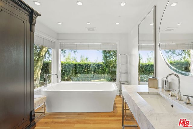 a bath tub sitting in front of a window