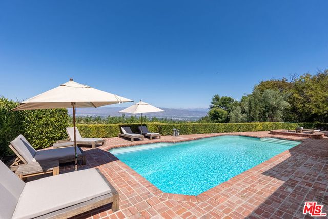 a garden view with a seating space