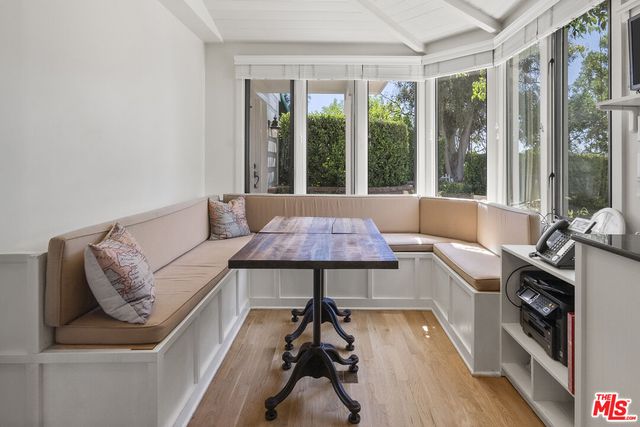 a large kitchen with a stove and a refrigerator