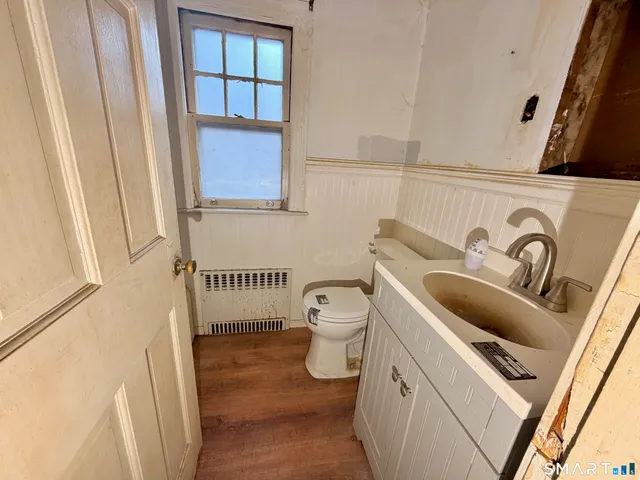 a bathroom with a sink and toilet