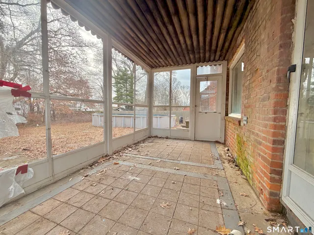 a view of empty room with windows