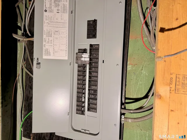 a view of a staircase with wooden floor and door