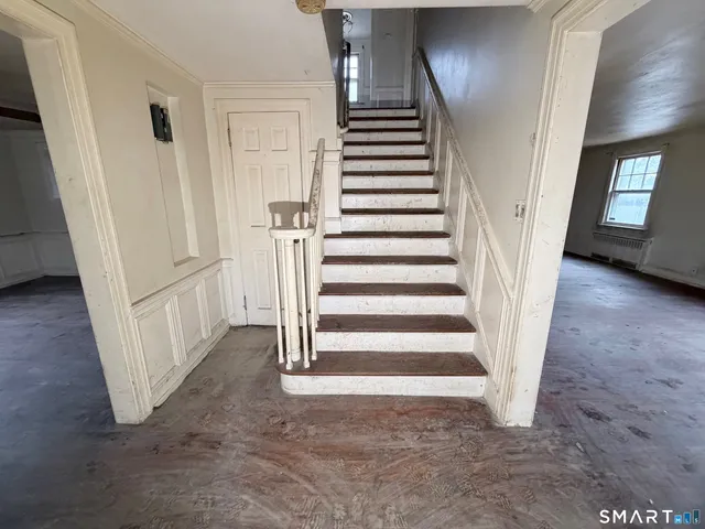 a view of a hallway with staircase