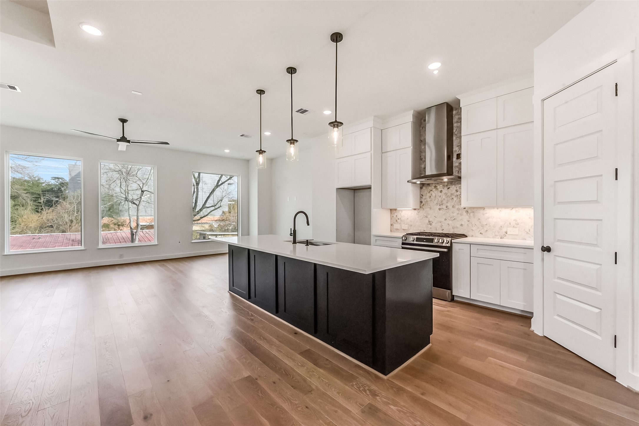 806 Fisher Street, Unit B Houston, TX 77018 - Photo 1 of 27 a large kitchen with stainless steel appliances kitchen island granite countertop a stove a sink and white cabinets
