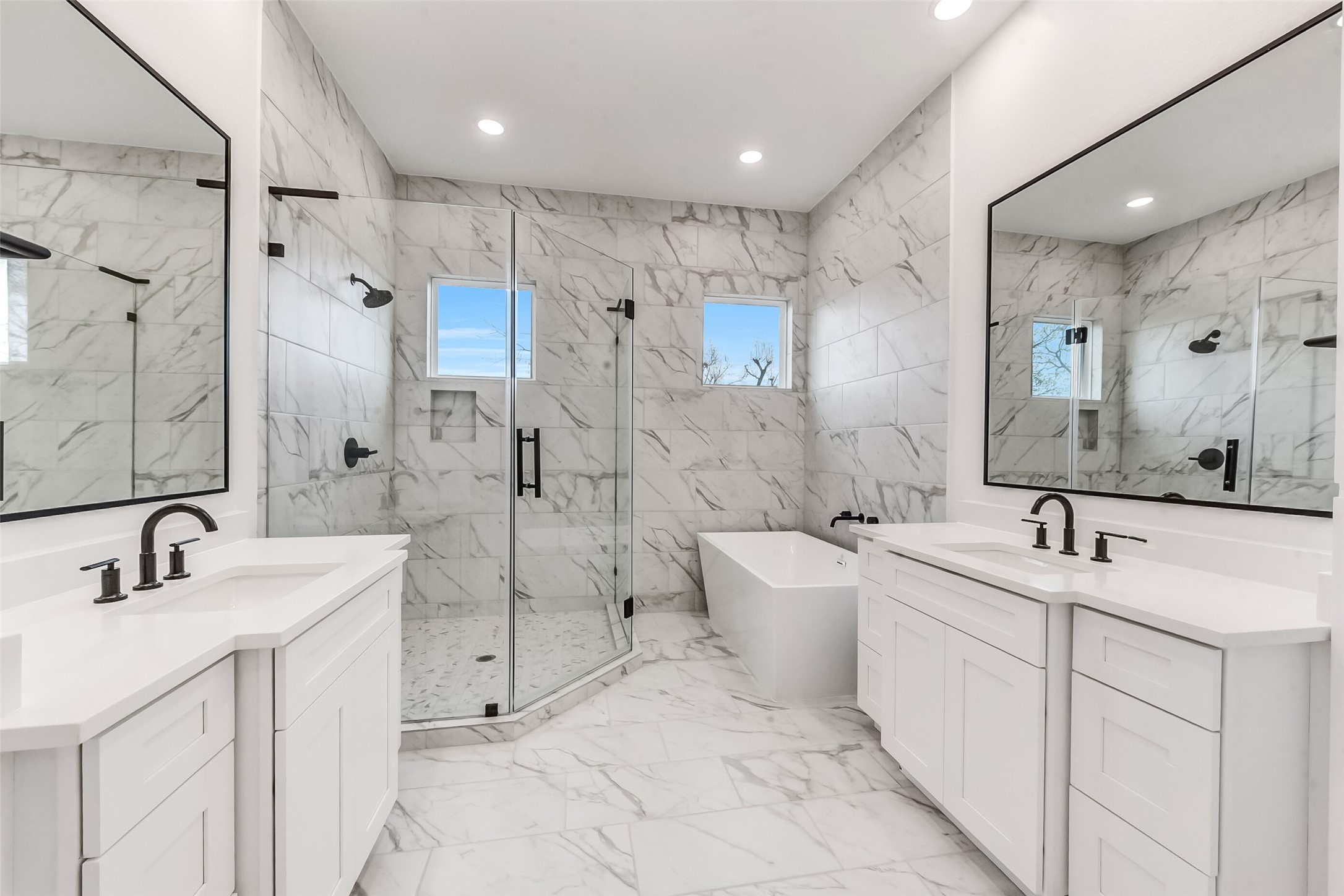 806 Fisher Street, Unit B Houston, TX 77018 - Photo 14 of 27 a bathroom with a double vanity sink mirror double and shower