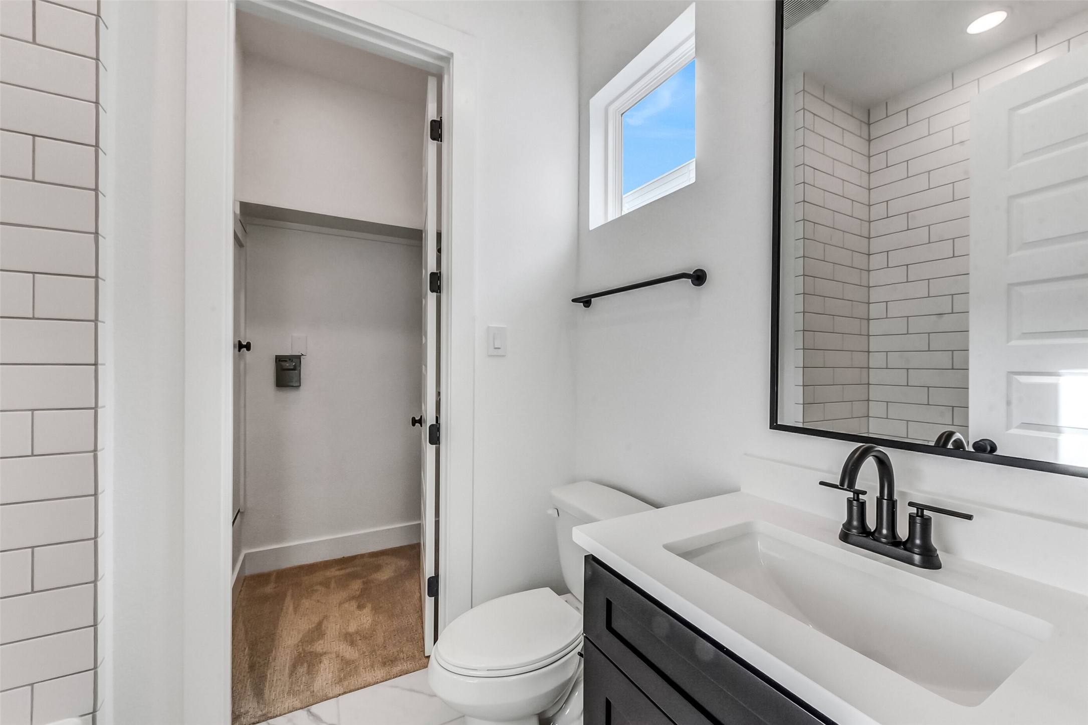 806 Fisher Street, Unit B Houston, TX 77018 - Photo 19 of 27 a bathroom with a sink toilet vanity and shower