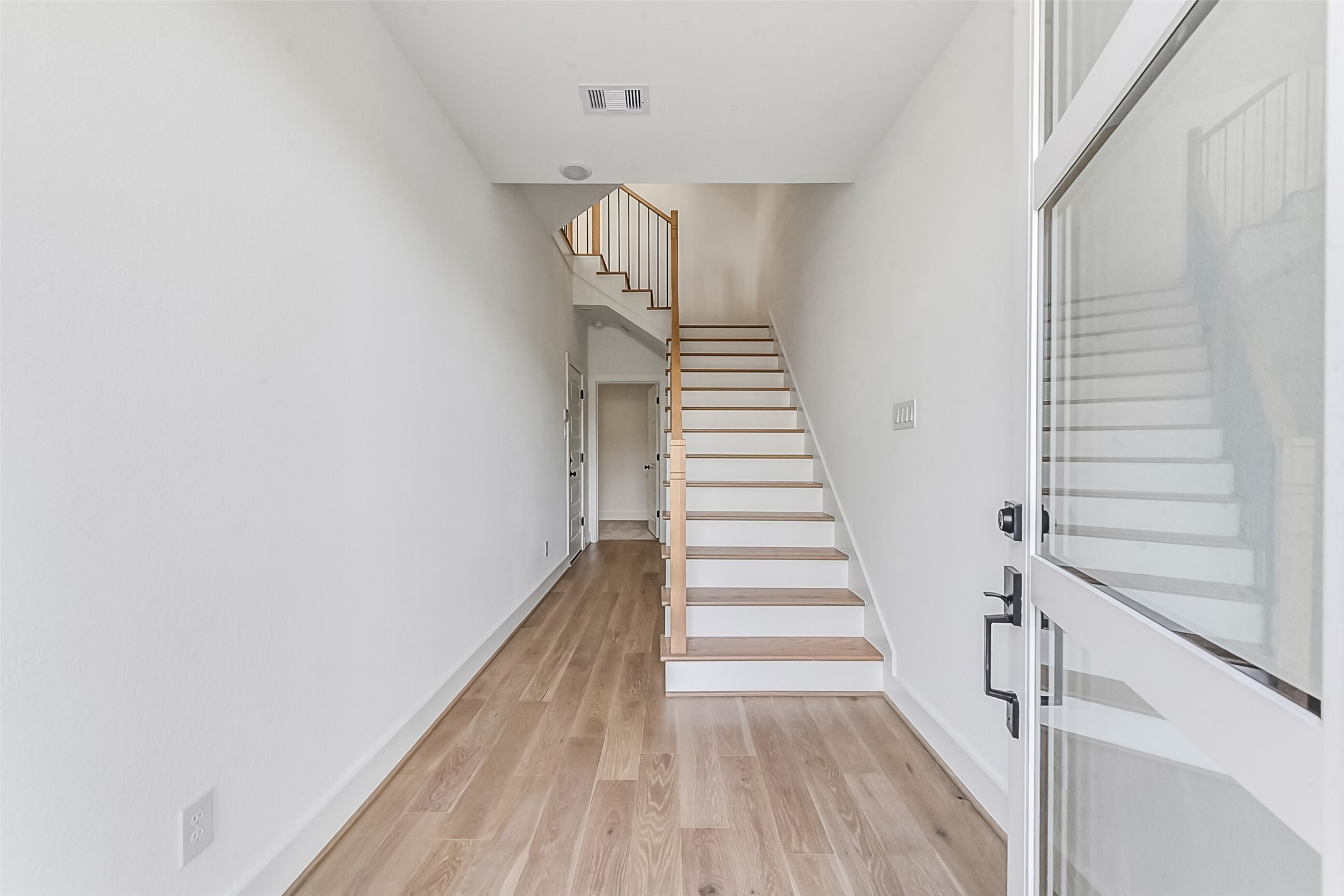 806 Fisher Street, Unit B Houston, TX 77018 - Photo 22 of 27 a view of entryway with wooden floor