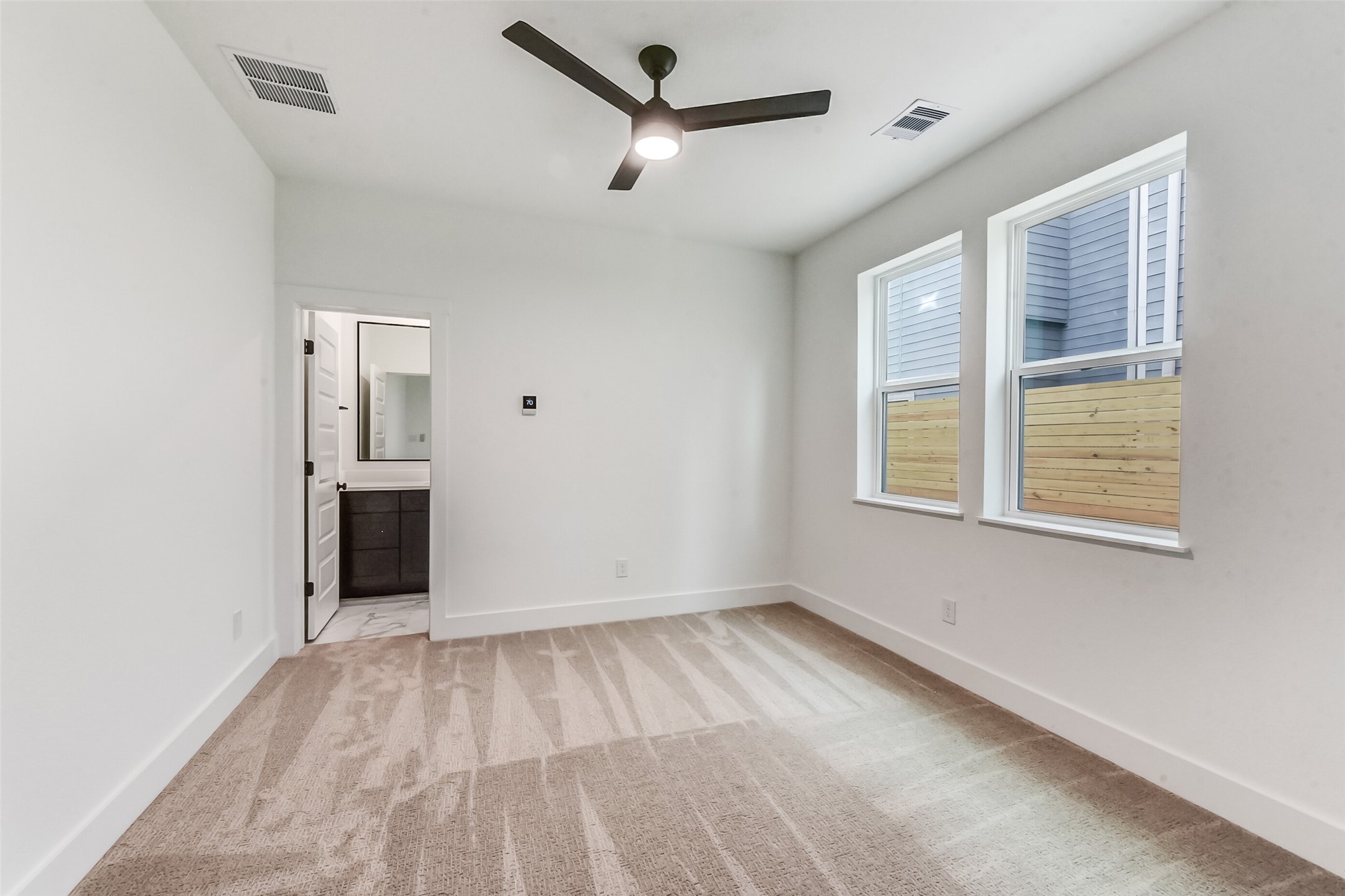 806 Fisher Street, Unit B Houston, TX 77018 - Photo 23 of 27 a view of empty room with wooden floor and ceiling fan