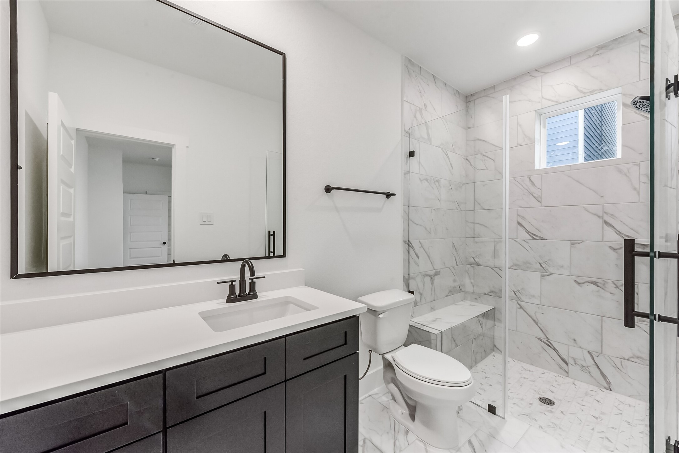 806 Fisher Street, Unit B Houston, TX 77018 - Photo 24 of 27 a bathroom with a sink toilet a mirror and shower