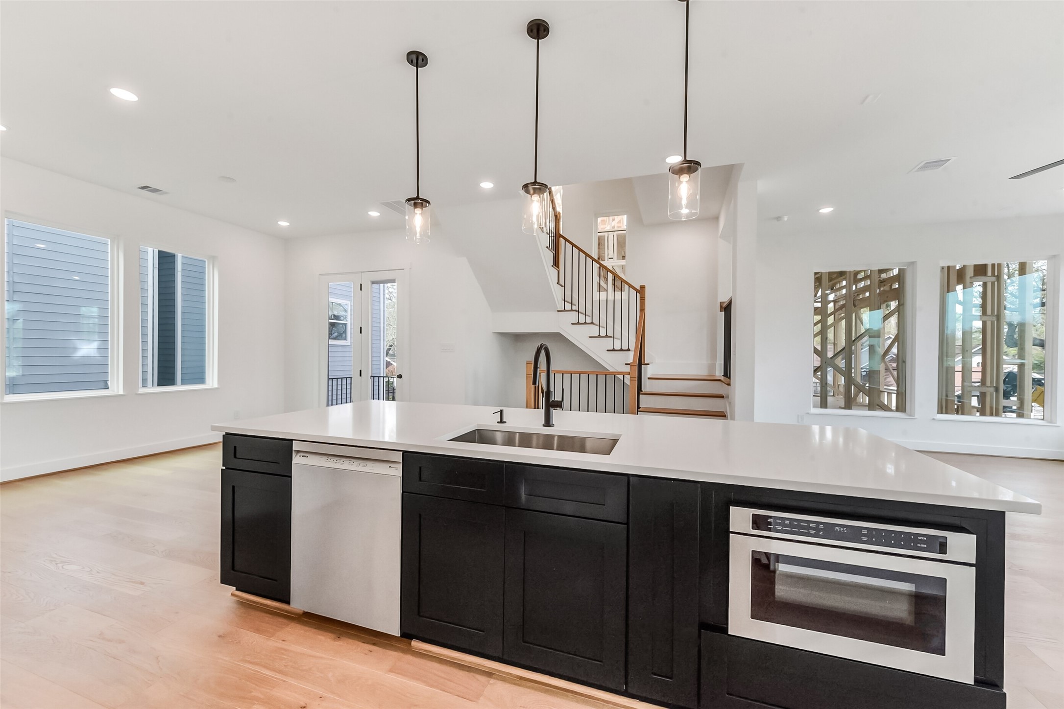 806 Fisher Street, Unit B Houston, TX 77018 - Photo 3 of 27 a kitchen with kitchen island a sink stainless steel appliances and a window