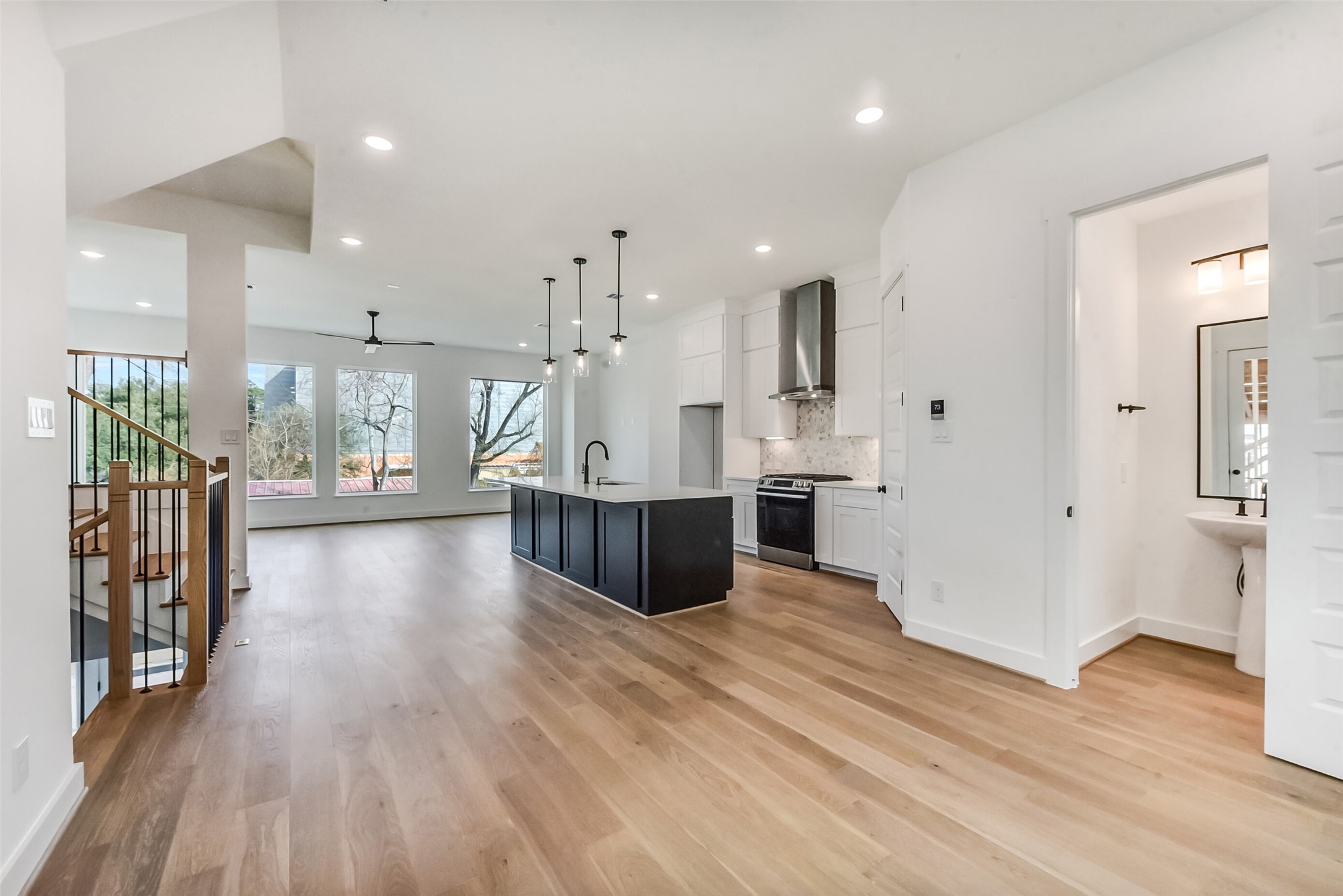 806 Fisher Street, Unit B Houston, TX 77018 - Photo 8 of 27 a view of kitchen with kitchen island wooden floor center island and stainless steel appliances