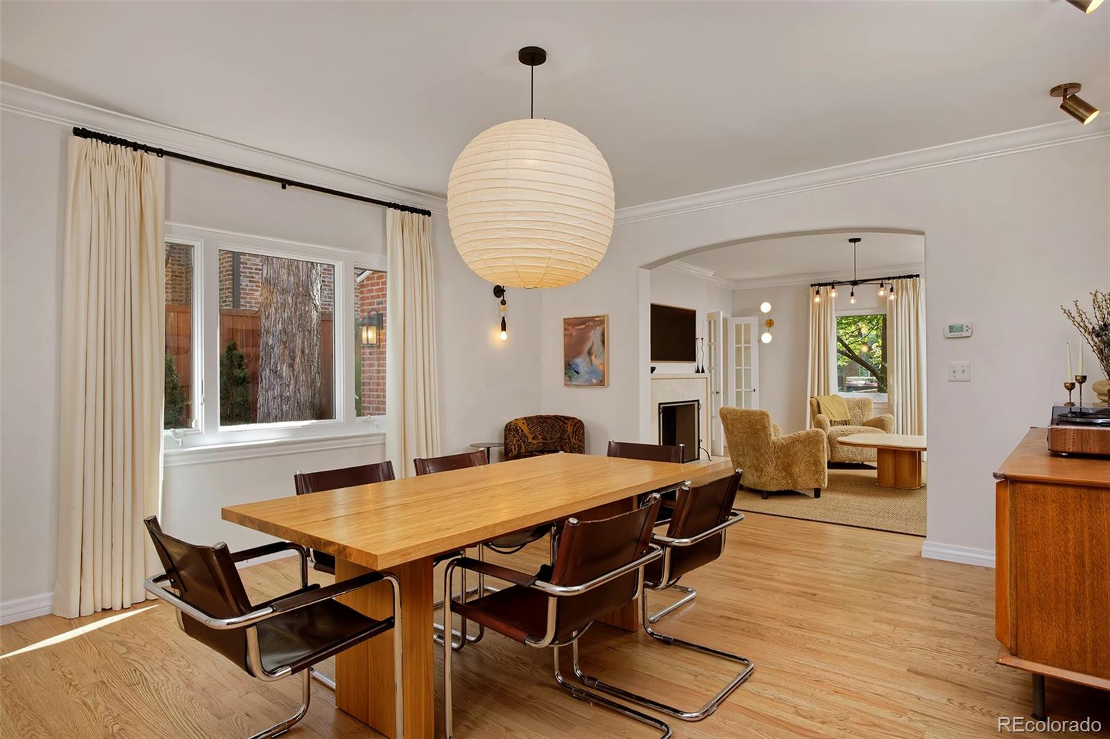 590 Race Street Denver, CO 80206 - Photo 13 of 50 a view of a dining room with furniture and wooden floor