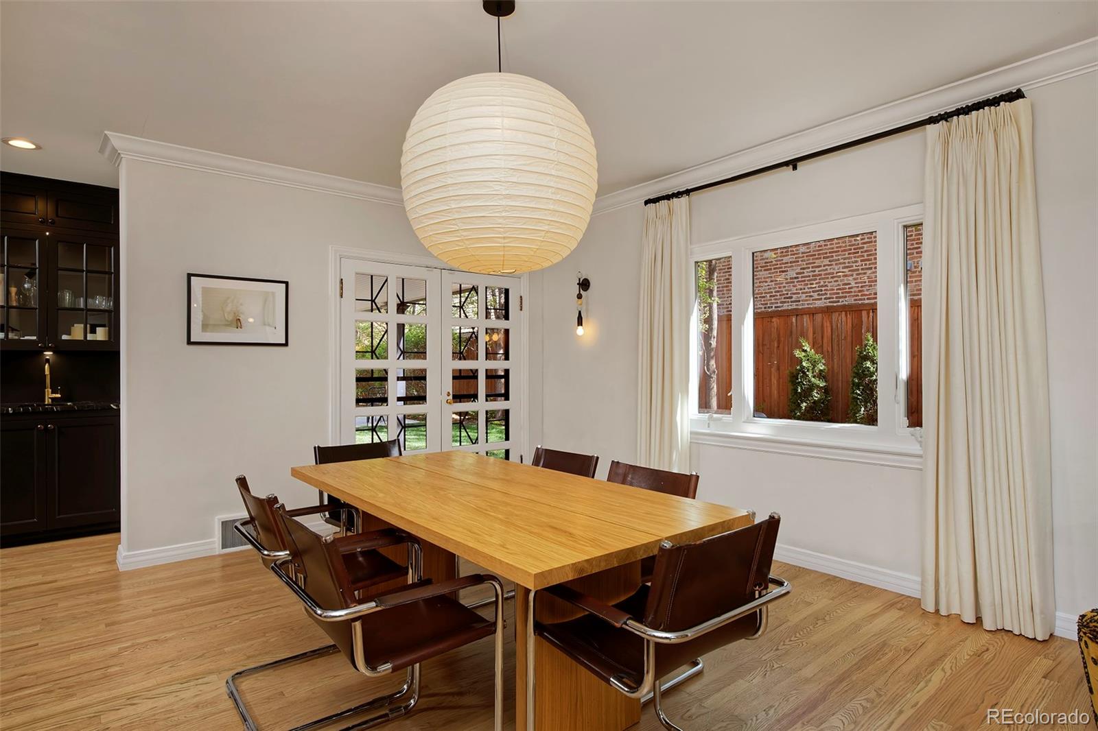 590 Race Street Denver, CO 80206 - Photo 14 of 50 a view of a dining room with furniture and wooden floor
