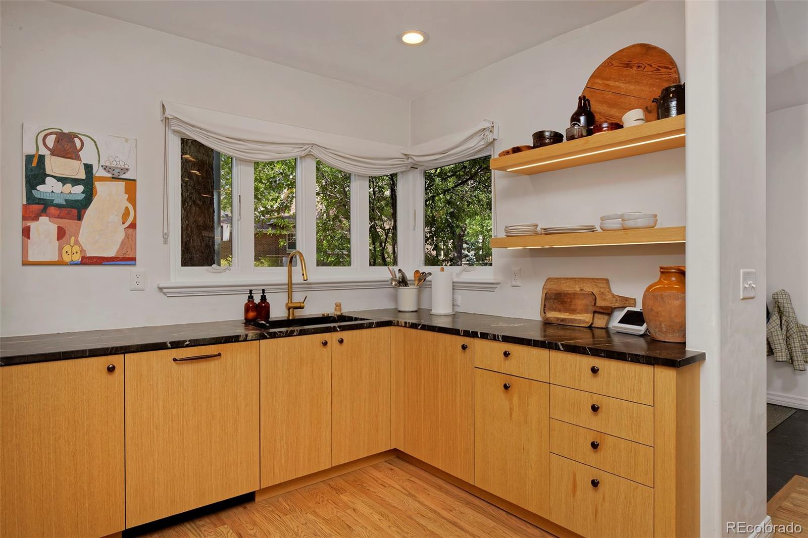 590 Race Street Denver, CO 80206 - Photo 21 of 50 a kitchen with granite countertop a sink and cabinets