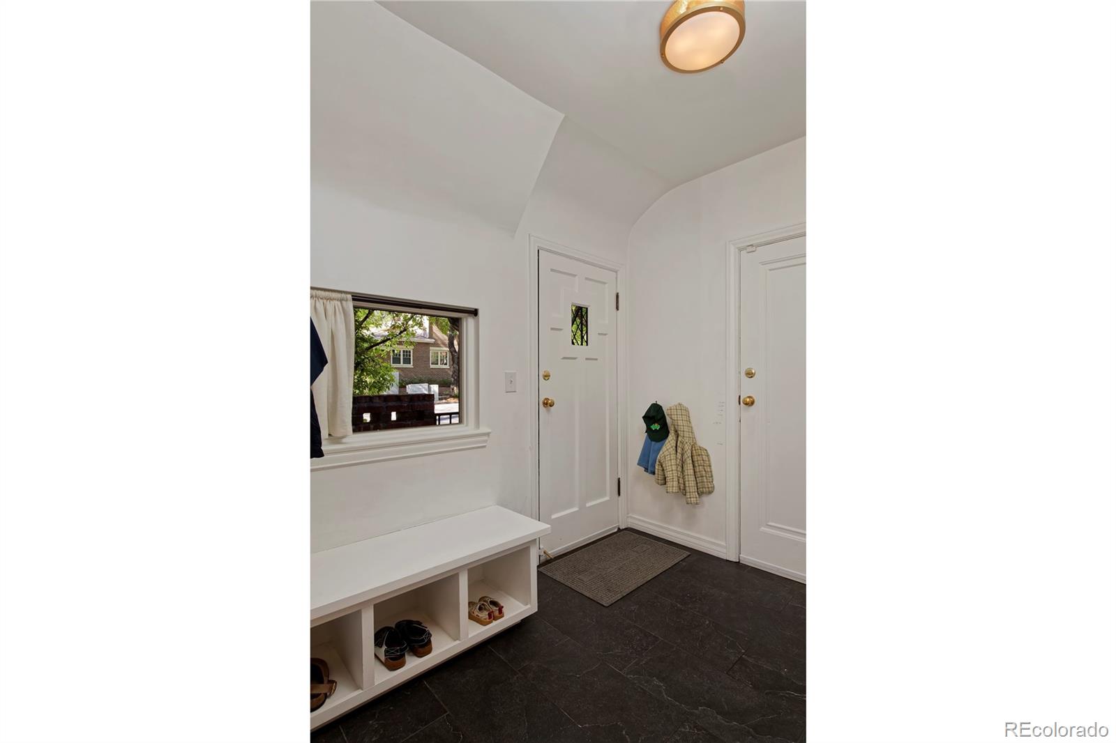 590 Race Street Denver, CO 80206 - Photo 24 of 50 a hallway with a white countertops with wooden floor