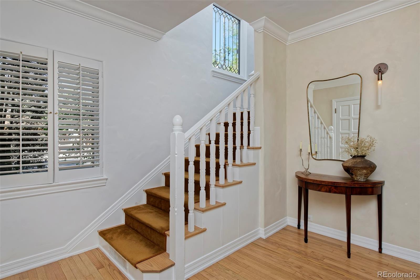 590 Race Street Denver, CO 80206 - Photo 25 of 50 a view of an entryway with wooden floor and front door