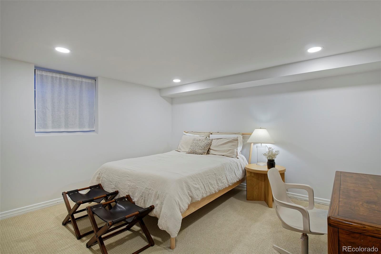 590 Race Street Denver, CO 80206 - Photo 40 of 50 a bedroom with a bed and a chair