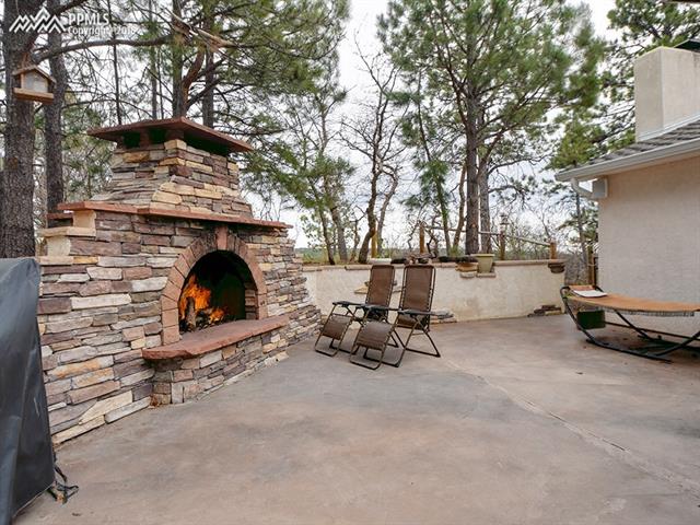 2660 Old North Gate Road Colorado Springs, CO 80921 - Photo 5 of 8 Wonderful Stone Fireplace For Outdoor Gatherings!