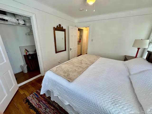 a bedroom with a bed and a dresser