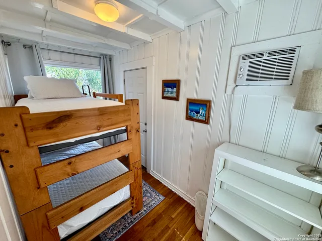 a view of room with wooden floor and a window