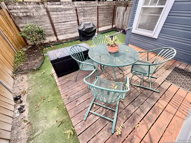 a view of a chairs and table in patio