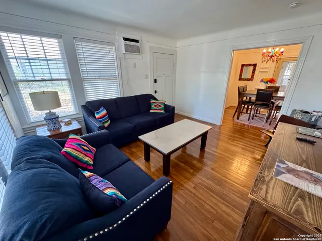 a living room with furniture and a table