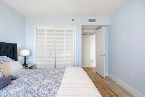 a bedroom with a bed and a toilet