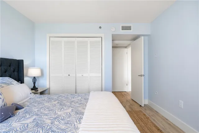 a bedroom with a bed and a toilet