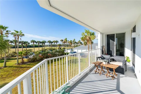 a view of balcony with furniture