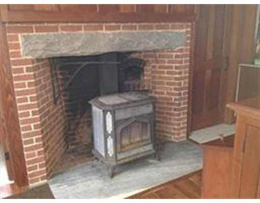 21 North County Road Leyden, MA 01337 - Photo 6 of 20 a fireplace with a wooden floor