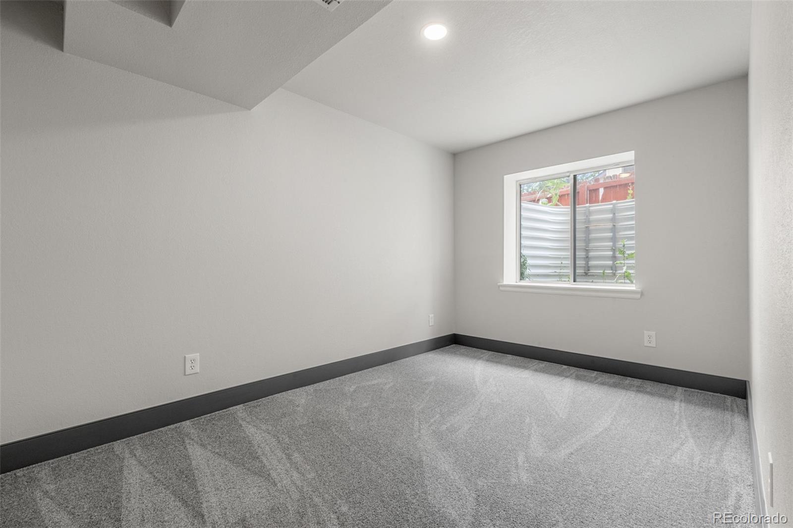 20412 East Chenango Place Aurora, CO 80015 - Photo 11 of 25 an empty room with a window