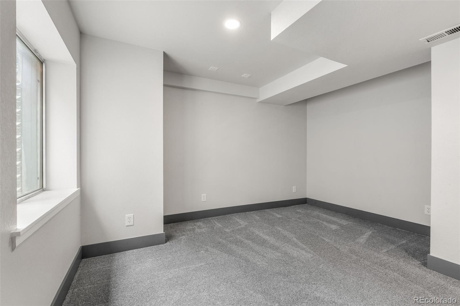 20412 East Chenango Place Aurora, CO 80015 - Photo 13 of 25 an empty room with a natural light