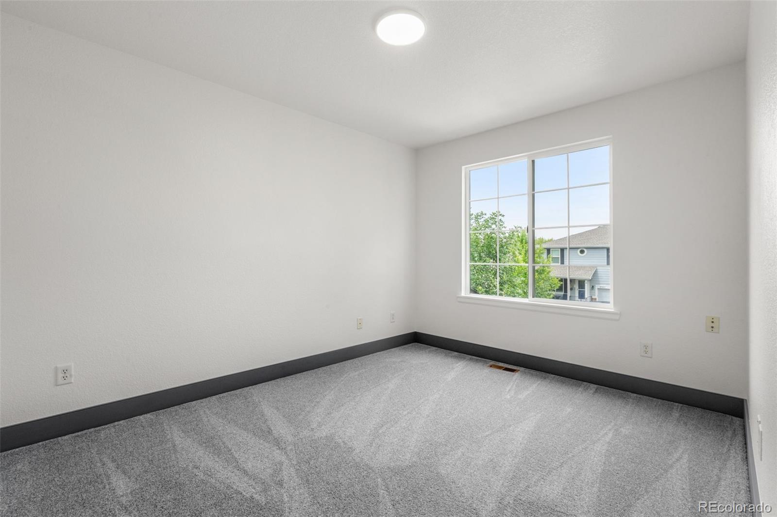 20412 East Chenango Place Aurora, CO 80015 - Photo 14 of 25 an empty room with a window