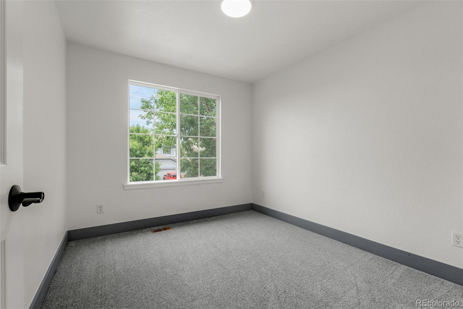 20412 East Chenango Place Aurora, CO 80015 - Photo 15 of 25 an empty room with a window