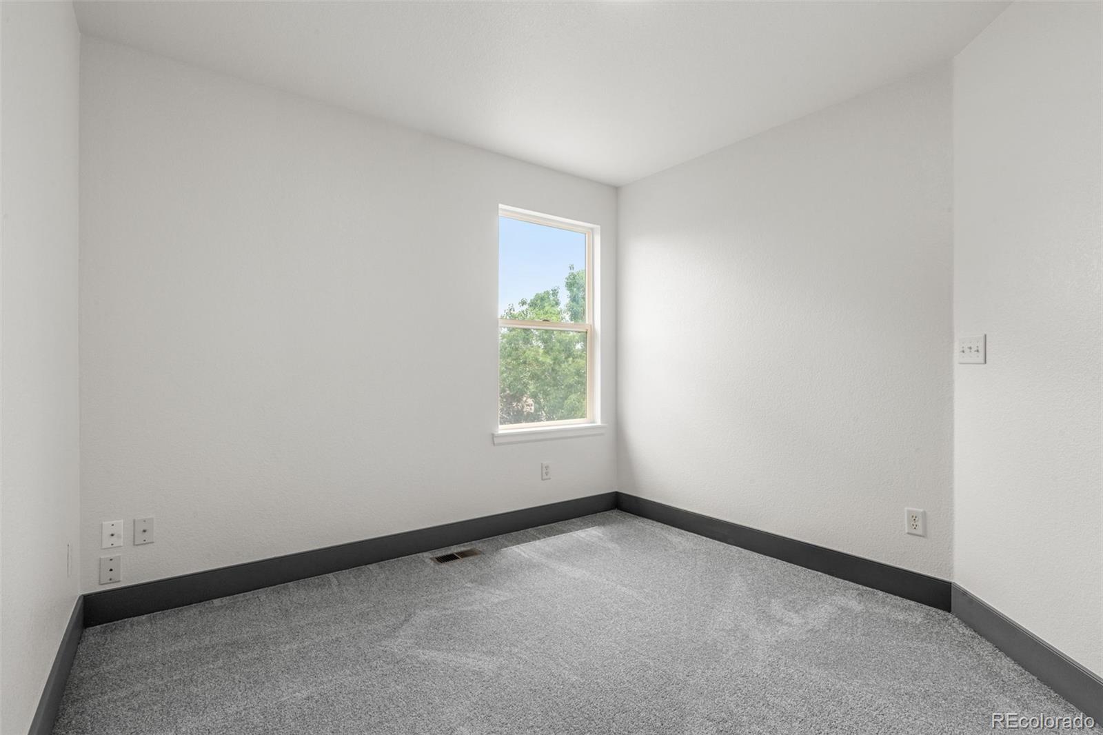 20412 East Chenango Place Aurora, CO 80015 - Photo 17 of 25 an empty room with a window