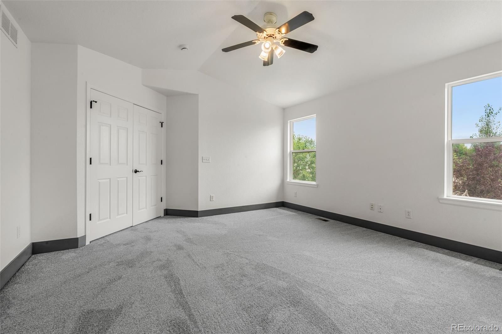 20412 East Chenango Place Aurora, CO 80015 - Photo 18 of 25 a view of an empty room with a window