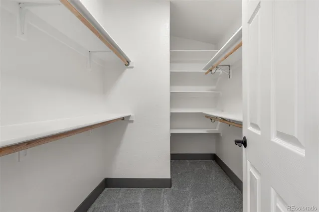 a view of an empty walk in closet