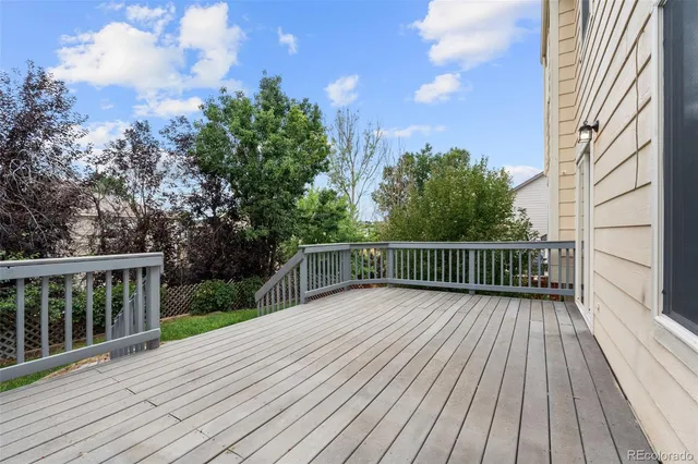 a view of deck with wooden floor and fence