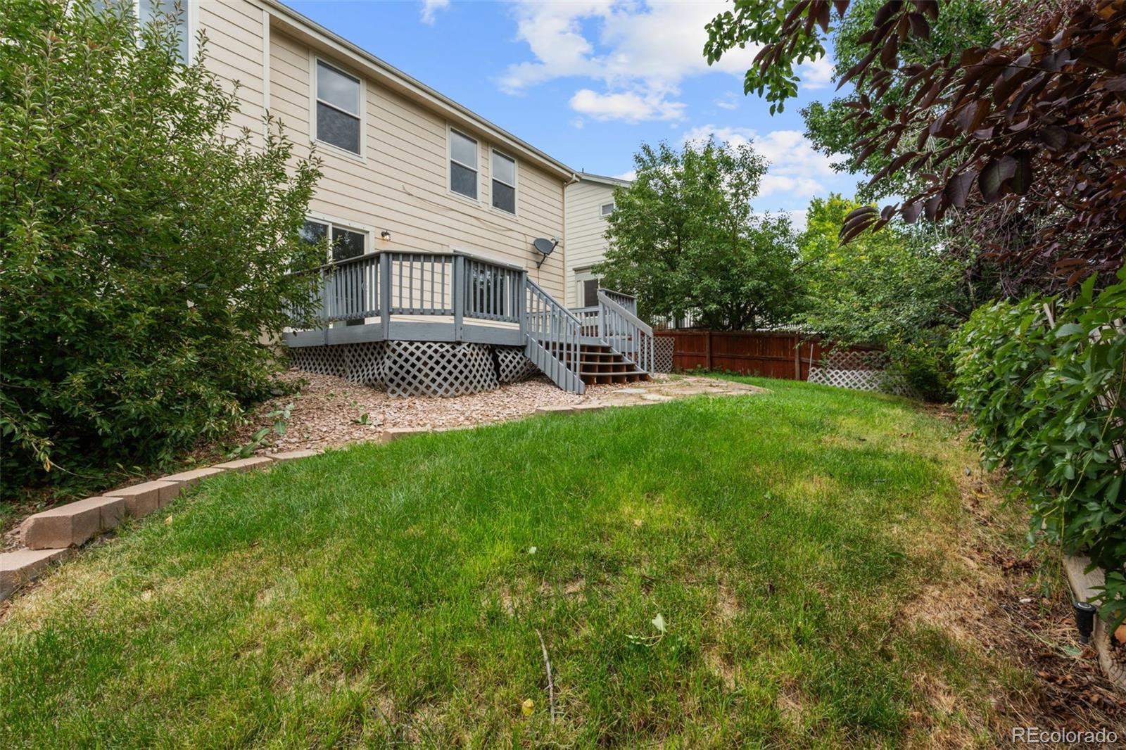 20412 East Chenango Place Aurora, CO 80015 - Photo 24 of 25 a view of a house with a yard porch and sitting area
