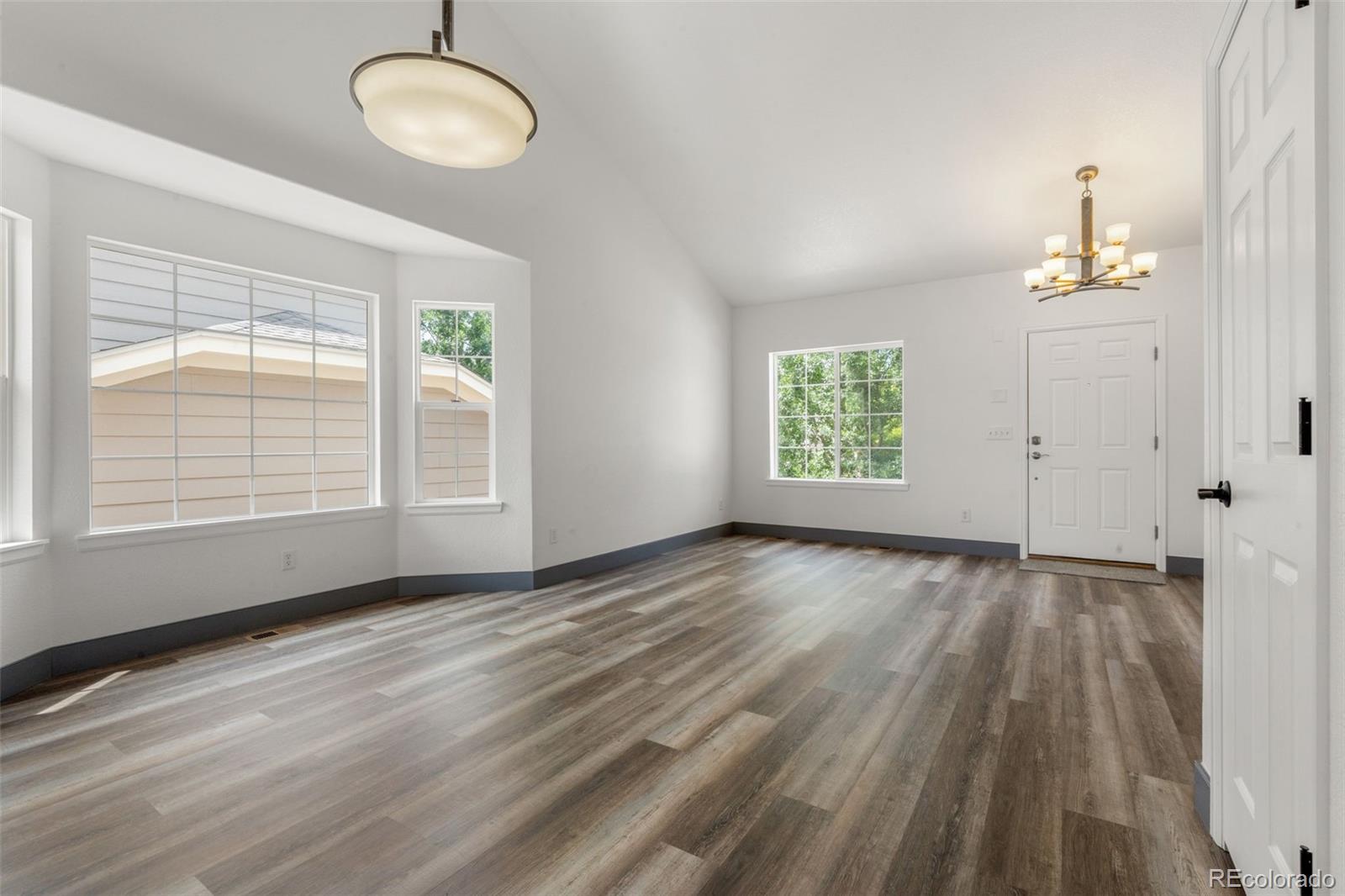 20412 East Chenango Place Aurora, CO 80015 - Photo 3 of 25 an empty room with windows