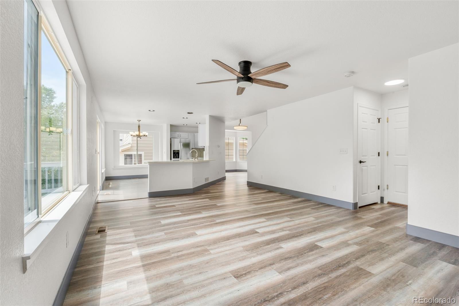 20412 East Chenango Place Aurora, CO 80015 - Photo 6 of 25 a view of a living room a stove and a window